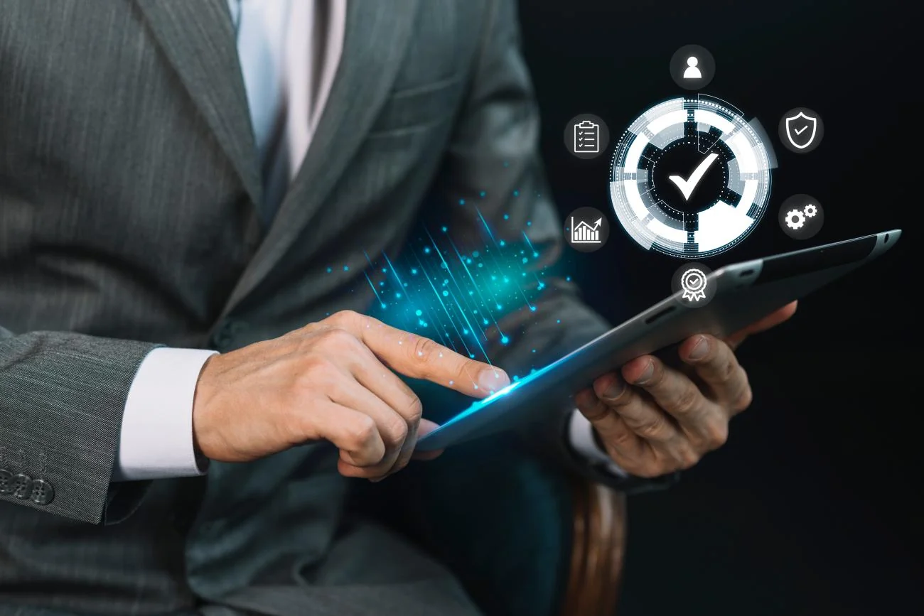A business professional reviewing trade quality and compliance on a tablet